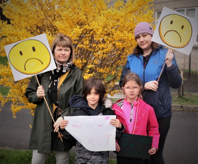 Parents Orla Mellon and Jean Weldon with students Irlah McConnell and Holly O'Doherty protesting at Riverview ETNS this morning. Photo: Aoife de Búrca.