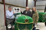 thumbnail: Harry Williams with Robert Roe and Rev Cathy Hallissey, with a photo of Charlie Keegan aboard his tractor.