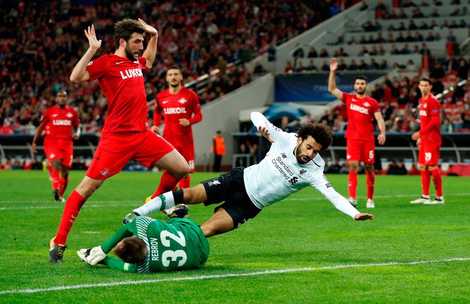 Spartak Moscow's Artem Rebrov saves at the feet of Liverpool's Mohamed Salah. Photo: Reuters