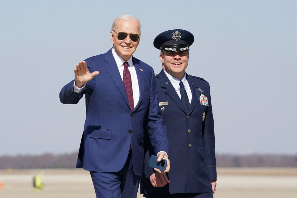 U.S. President Joe Biden waves as he boards Air Force One. REUTERS/Kevin Lamarque