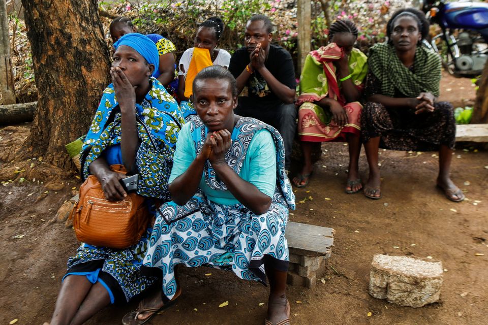 Relatives of cult followers await news of their loved ones. Photo: Reuters