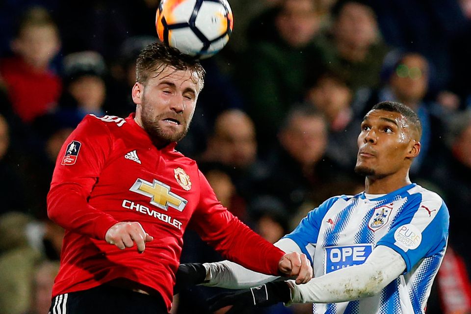 Manchester United defender Luke Shaw rises above Huddersfield Town’s Collin Quaner in his side’s 2-0 FA Cup fifth-round victory at John Smith’s Stadium yesterday. Photo: Reuters