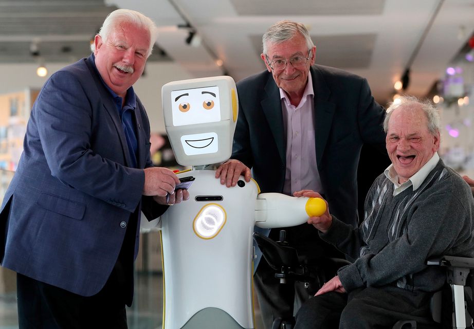 IrelandÕs first socially assistive AI robot 'Stevie II' from robotics engineers at Trinity College Dublin, with Mick McCarthy (left) Tony McCarthy (centre) and Brendan Crean, who all helped trial the robot through the charity ALONE, during a special demonstration at the Science Gallery in Dublin. 
Brian Lawless/PA Wire