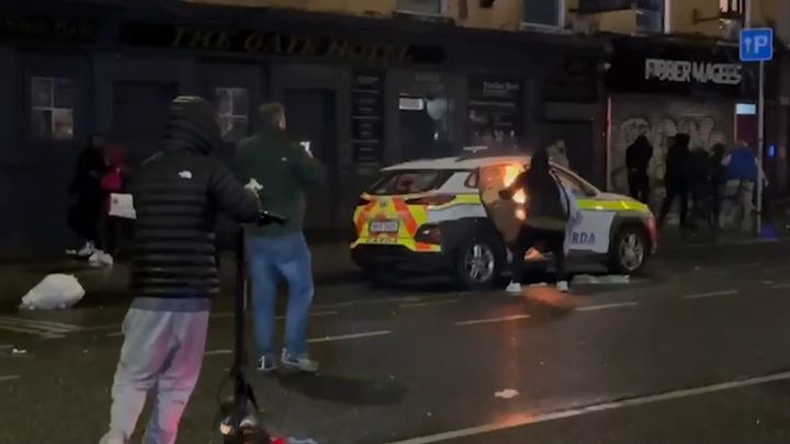 Dublin rioter who burnt out garda car and attacked migrant hostel shouts 'scumbags' as he gets six-and-a-half year prison sentence