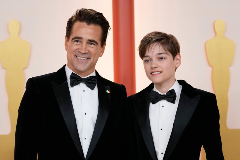 Colin Farrell and his son Henry Tadeusz arrive at the Oscars on Sunday, March 12, 2023, at the Dolby Theatre in Los Angeles. (AP Photo/Ashley Landis)
