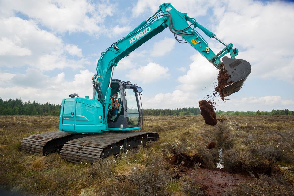 Bord na Móna machines fill in the ditches on Clonwhelan Bog, Edgeworthstown, Co Longford, as part of the rewetting. Photo: Jeff Harvey