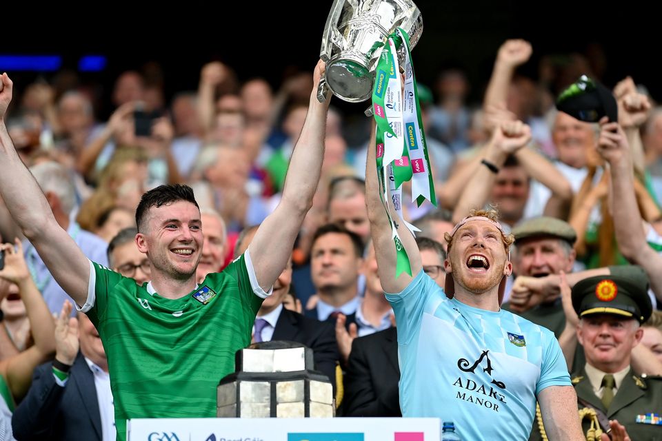 Declan Hannon, left, and Cian Lynch of Limerick lift the Liam MacCarthy Cup. Photo by Stephen McCarthy/Sportsfile