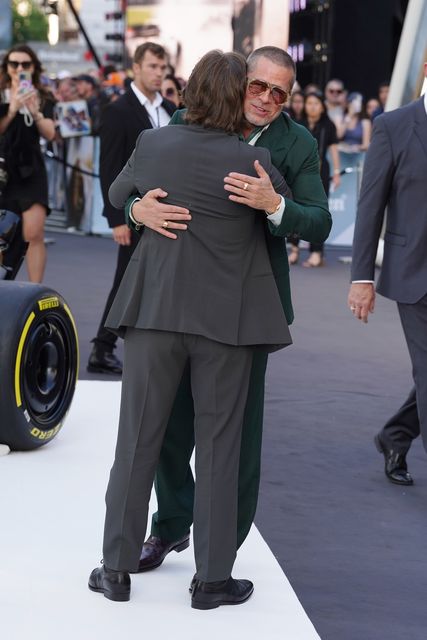 Brad Pitt and Tom Cruise embrace at the F1: The Movie European premiere (Ian West/PA)