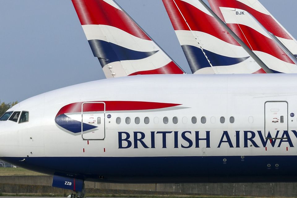British Airways owner IAG has seen earnings knocked by a 155 million euro (£134m) hit from a summer of strike action (Steve Parsons/PA)