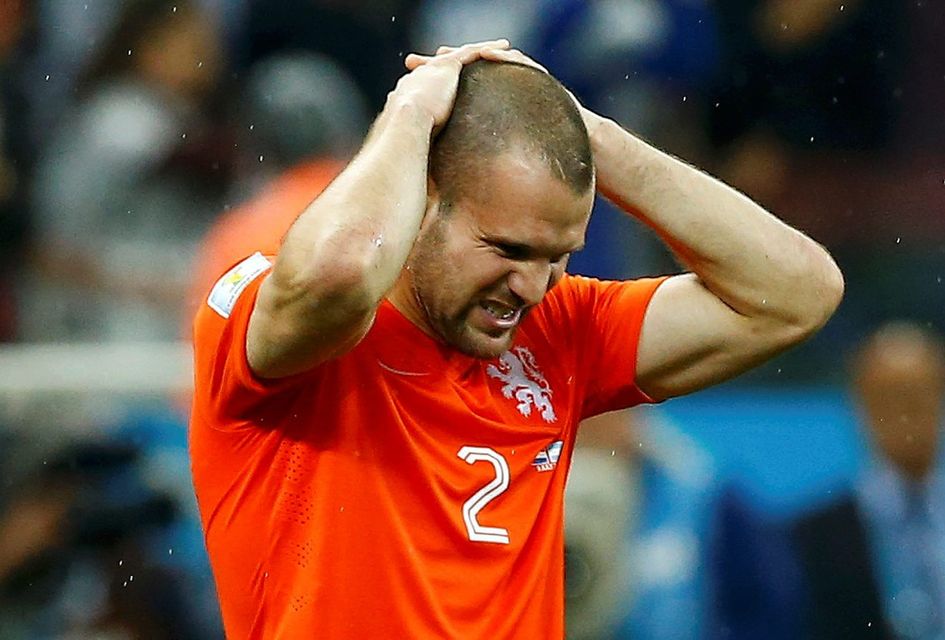 Ron Vlaar ponders what could've been after his spot-kick stopped agonisingly short of crossing the line in the Netherlands' World Cup semi-final penalty shootout against Argentina. Photo: REUTERS/Darren Staples