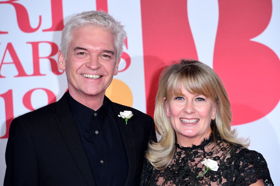 Phillip Schofield and Stephanie Lowe attending the Brit Awards in 2018 (PA)