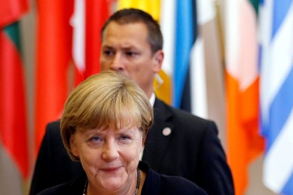 Germany's Chancellor Angela Merkel leaves an emergency euro zone summit in Brussels