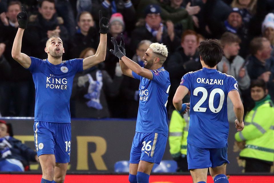 Leicester's Islam Slimani (left) celebrates his goal with fellow scorer Riyad Mahrez in the Foxes' 3-0 win over Huddersfield.