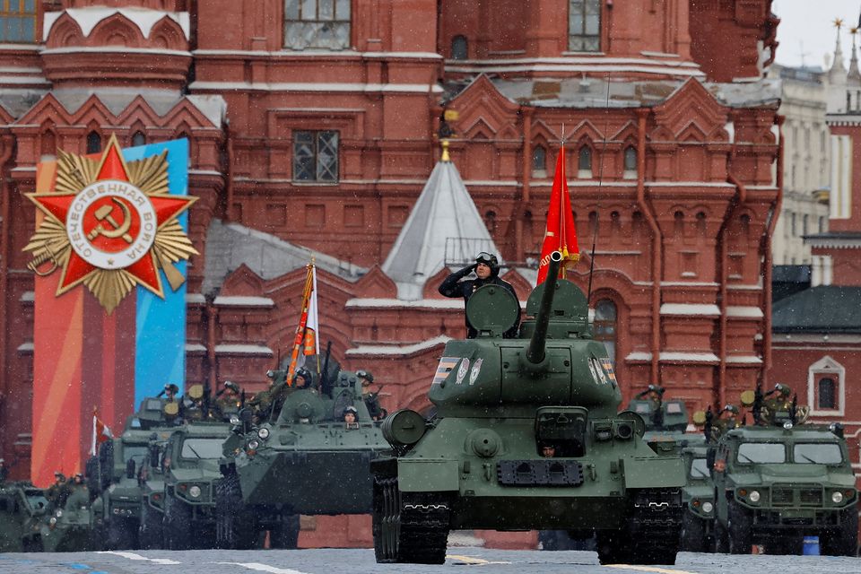 A T-34 Soviet-era tank and other armoured vehicles drive along Red Square during Victory Day. Photo: Reuters