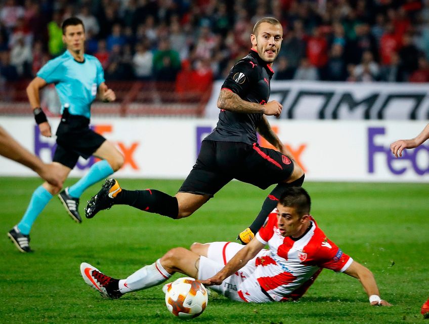 Jack Wilshere threads the ball past Red Star's Vujadin Savic. Photo: Srdjan Stevanovic/Getty Images