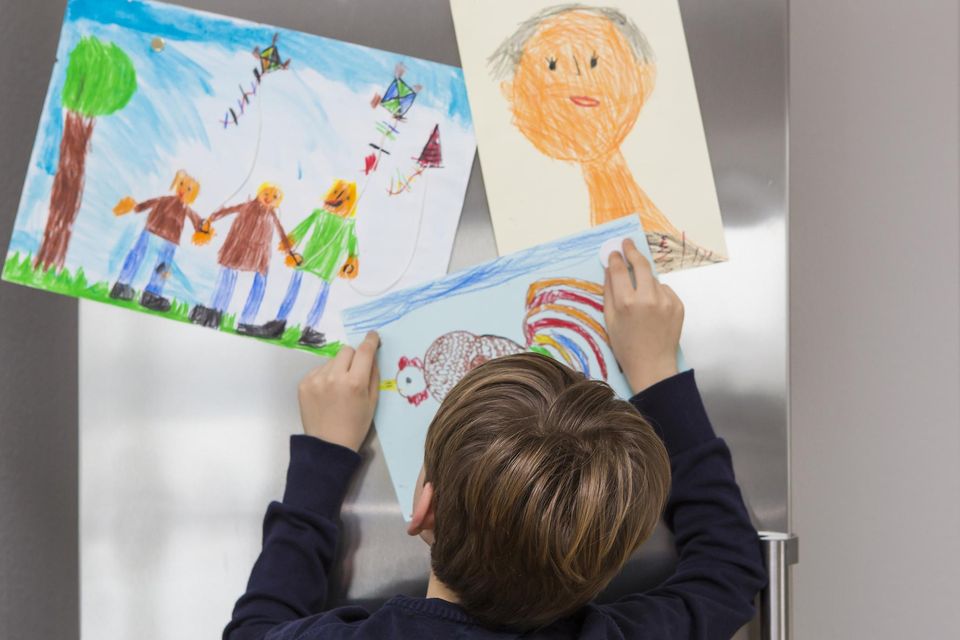 Artwork fridge displays generally become a thing of the past after the firstborn. Photo: Getty/picture posed