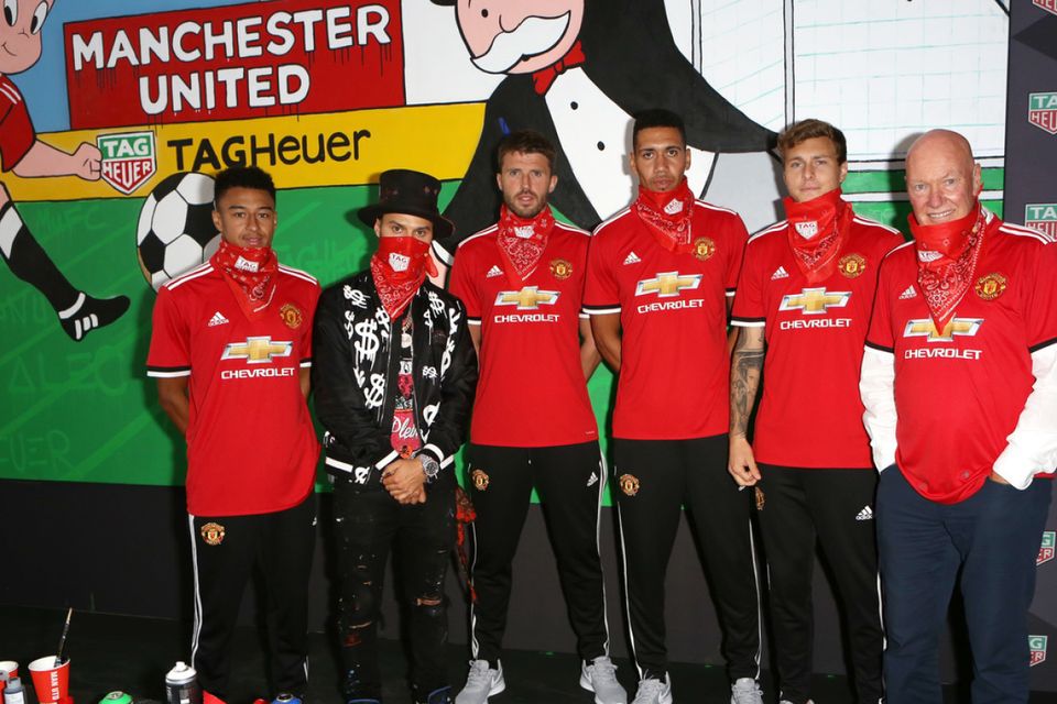 Manchester United players met graffiti artist Alec Monopoly at Old Trafford for the unveiling of a mural (TAG Heuer)