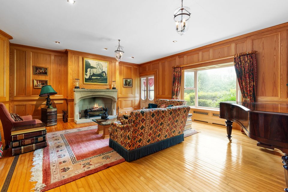 One of the wood-panelled reception rooms