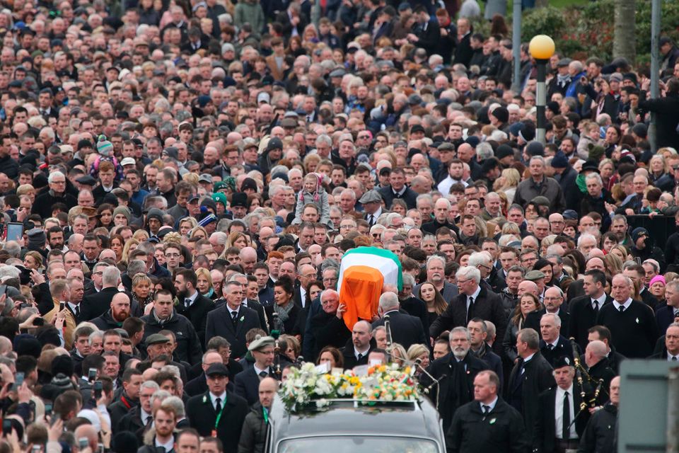 Huge crowds line the route of the funeral cortege. Photo: Gerry Mooney