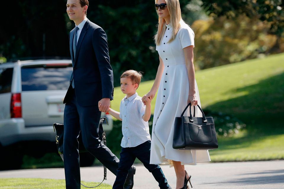 White House Senior Adviser Jared Kushner, left, Ivanka Trump, right, the daughter and assistant to President Donald Trump, and their son Joseph Kushner, center, walk across the South Lawn of the White House in Washington, before boarding Marine One helicopter, Friday, June 29, 2018, for the short flight to nearby Andrews Air Force Base, Md. (AP Photo/Pablo Martinez Monsivais)