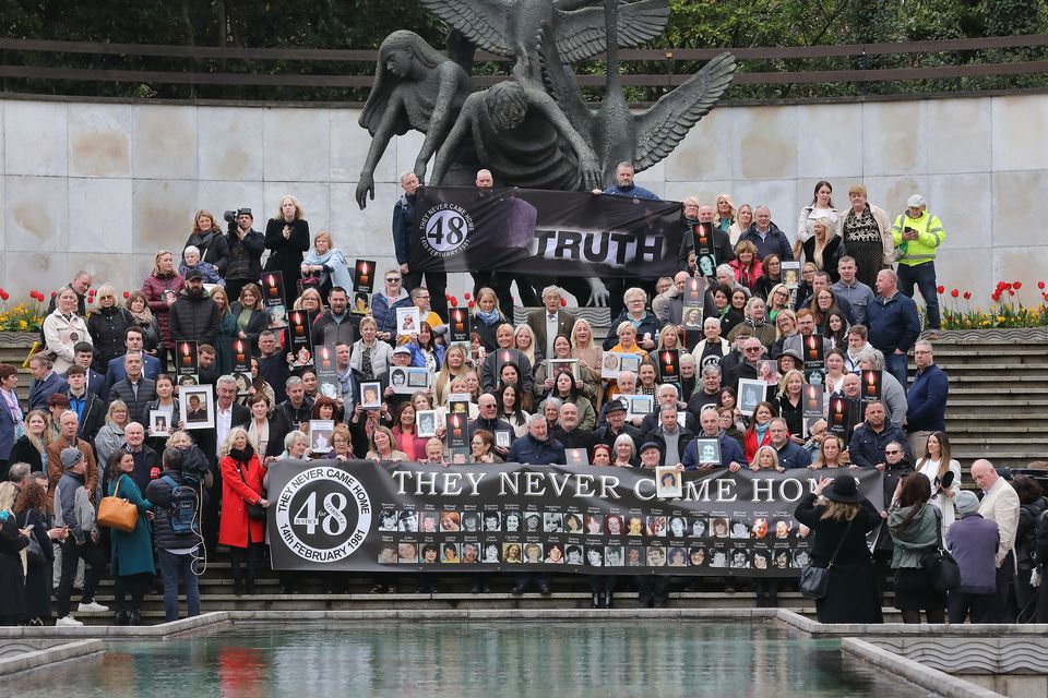 Survivors of the Stardust fire, as well as family and friends of the 48 victims, in the Garden of Remembrance after the inquest verdicts. Photo: Frank McGrath