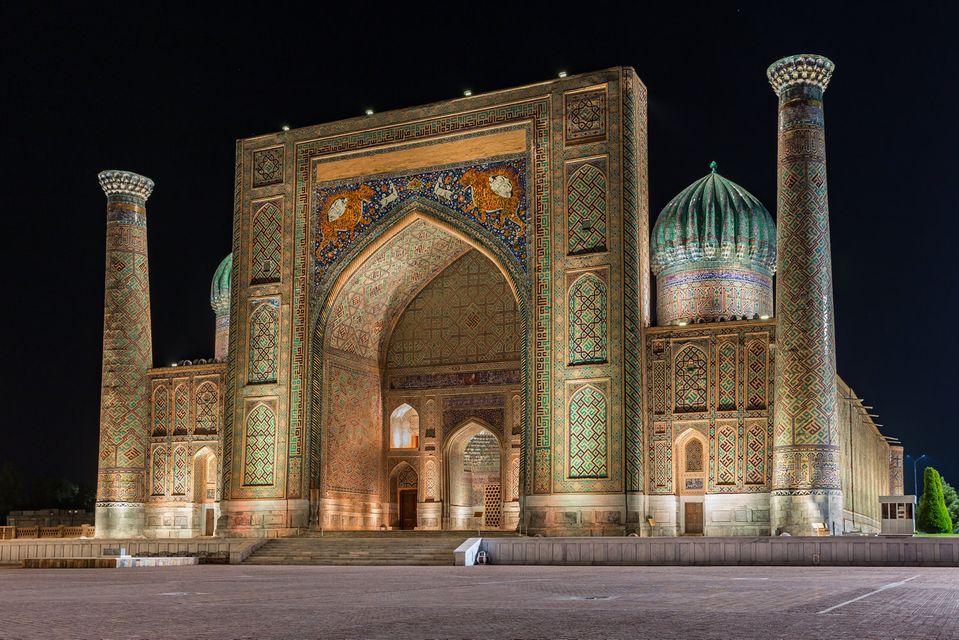 View of Sher-Dor Madrasah at night in Samarkand, Uzbekistan