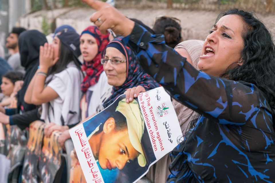 Protests at the trial of an Israeli man charged with burning a 15-year
-old Palestinian boy to death in a local park. He got a life sentence.