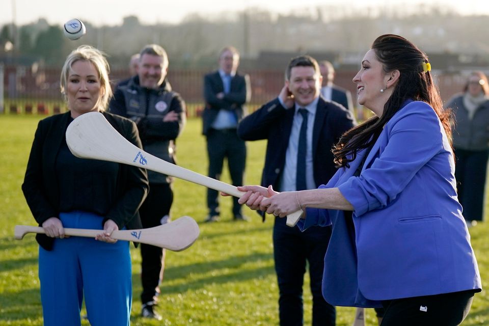 Northern Ireland First Minister Michelle O'Neill (left) and Deputy First Minister Emma Little-Pengelly during a visit to St. Paul's GAA club in west Belfast. Picture date: Wednesday March 6, 2024. Photo: Niall Carson/PA Wire