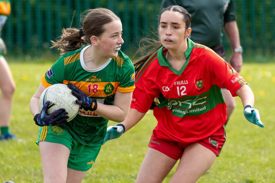 Kilcoole's Ornagh McDermott looks to get past Rathnew's Lucy Dempsey. 