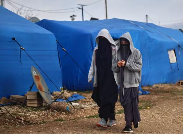 Australia vows prosecutions as Islamic State‑linked citizens return from Syrian detention camp