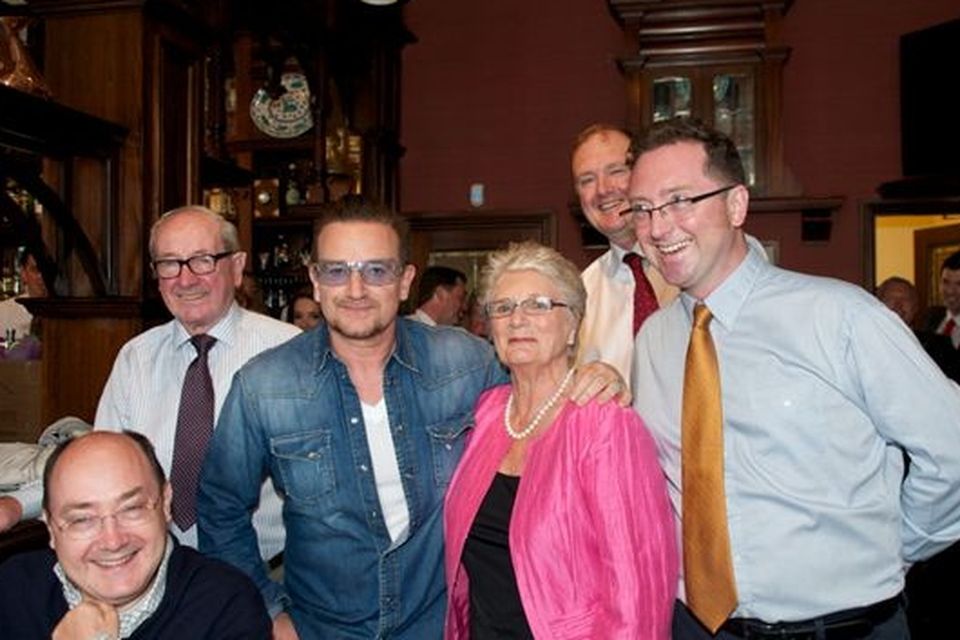 Left to right: Neil, Dan, Bono, Paul (background) Mrs Finnegan, Donal and Alan