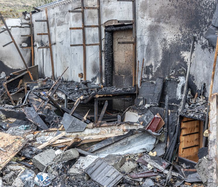 The devastating aftermath of a fire that burnt a family home to the ground. All that remains is part of a workshop on the site. Photo by Michael Donnelly. 
