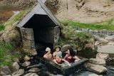 thumbnail: Friends enjoy a dip in a natural thermal spa. Photo: Getty