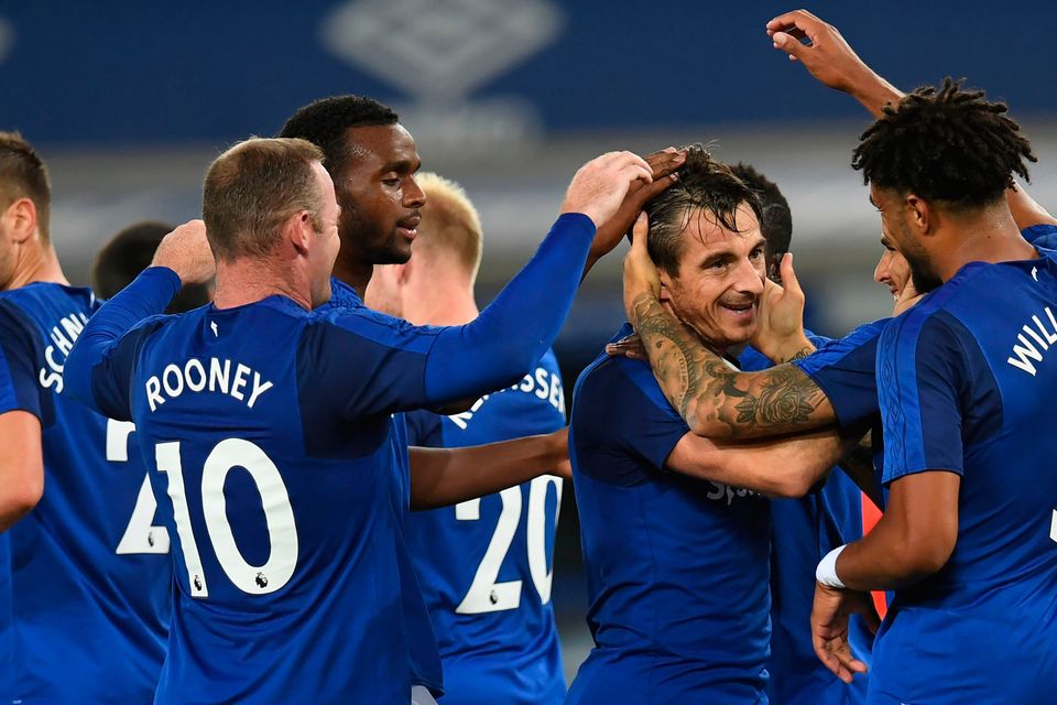 Everton's defender Leighton Baines celebrates with teammates, after scoring his goal. Photo: Getty Images