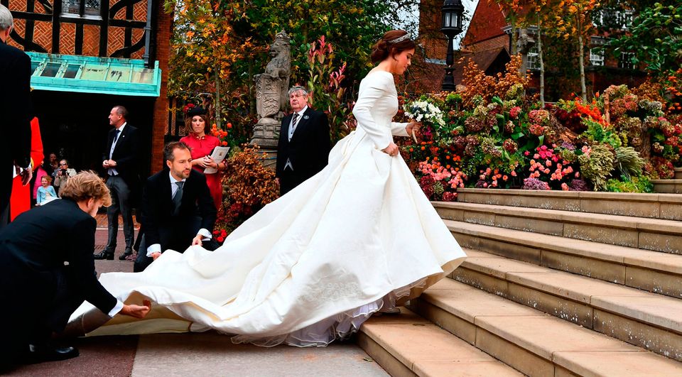 Britain's Princess Eugenie of York (R) arrives for her wedding to Jack Brooksbank at St George's Chapel, Windsor Castle, in Windsor, on October 12, 2018. (Photo by Victoria Jones / POOL / AFP)VICTORIA JONES/AFP/Getty Images