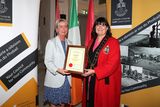 thumbnail: Ann Kierans accepts the award from Mayor Michelle Hall. 