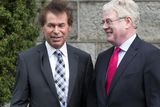 thumbnail: Former Minister for Justice Alan Shatter smiling with Tanaiste Eamon Gilmore at the annual 1916 Commemoration Ceremony in Arbour Hill yesterday hours before his resignation. 
Picture: Mark Condren