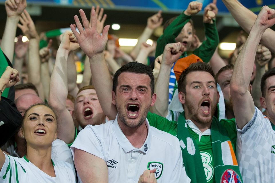 Robbie Brady's girlfriend Kerrie Harris (left) and brother (centre) show their emotions at full time against Italy