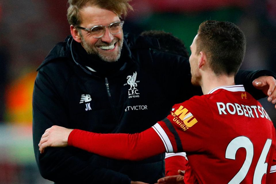 Liverpool manager Juergen Klopp and Andrew Robertson celebrate after the match