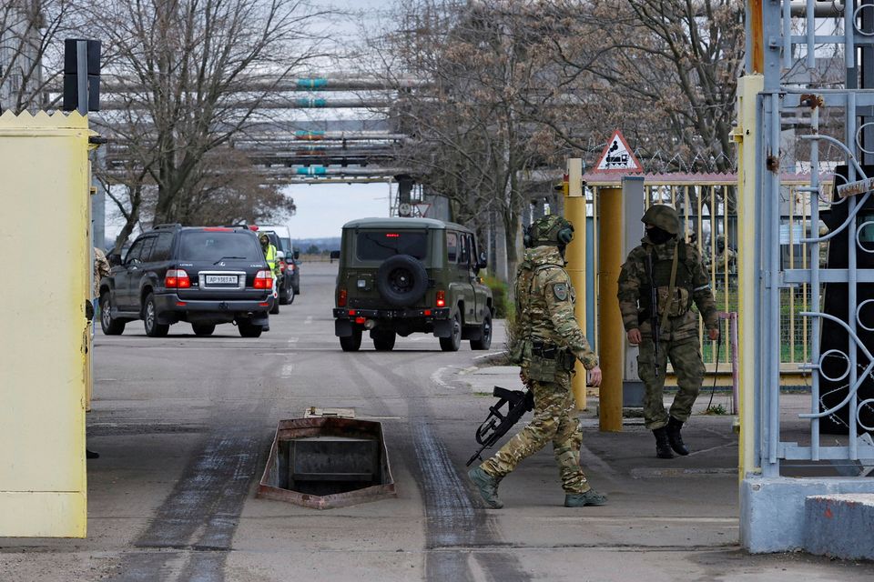 Russian soldiers guard the entrance to the Zaporizhzhia nuclear power plant during a visit of the International Atomic Energy Agency (IAEA) mission. Photo: Alexander Ermochenko/File Photo/Reuters
