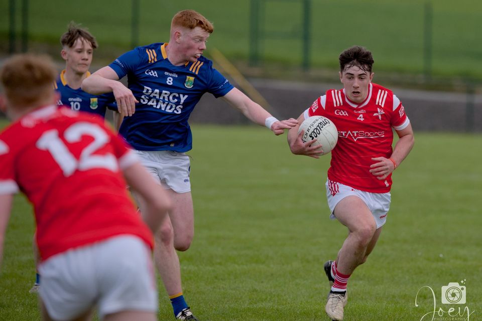 Louth's Donnacha Skinnader and Mark Kinsella of Longford during Wednesday night's Leinster MFC quarter-final tie in Hunterstown. Picture: Joey Photography/Louth GAA