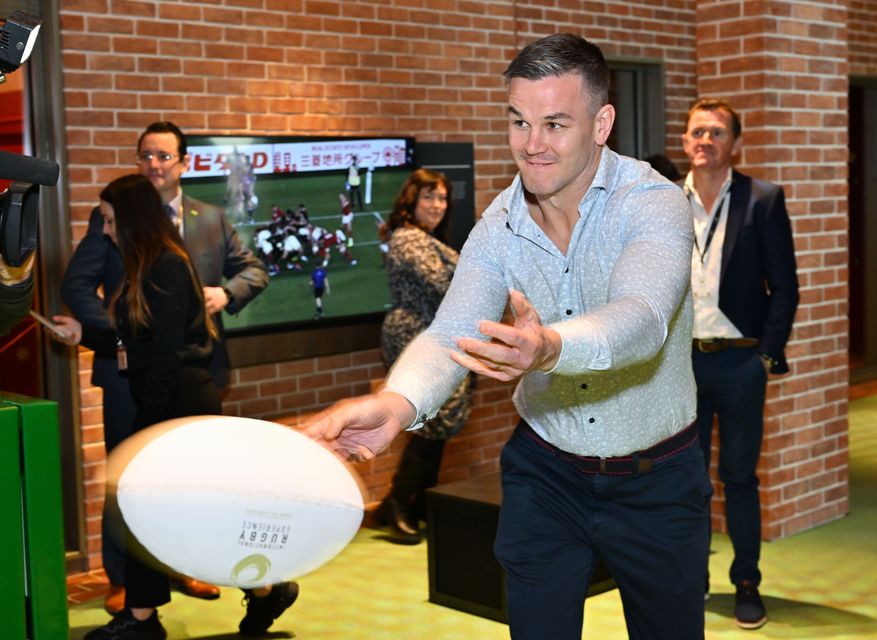 Jonathan Sexton tests his passing skills at the opening of the International Rugby Experience in Limerick.