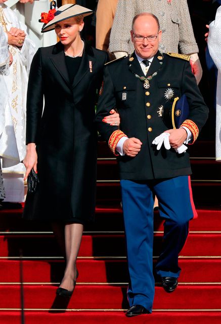 Prince Albert II of Monaco (R) and princess Charlene of Moanco (L) leave the cathedral after a mass during the celebrations marking Monaco's National Day