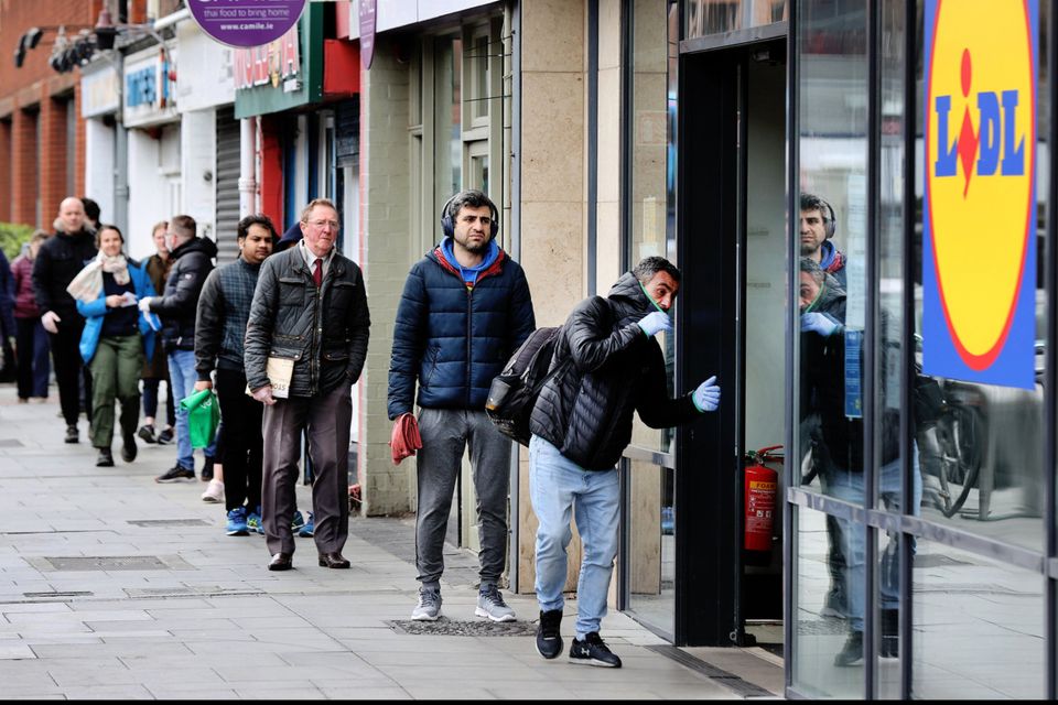 Shoppers queue in Rathmines after lockdown restrictions were announced