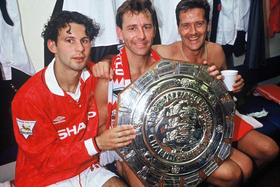 Manchester United's Ryan Giggs, Bryan Robson and Les Sealey celebrate in the dressing room after beating Arsenal 5-4 on penalties in the Charity Shield match at Wembley Stadium in August 1993.