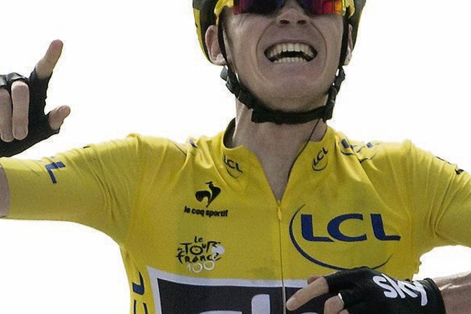 Chris Froome celebrates as he crosses the line to win stage 15 of the Tour de France
