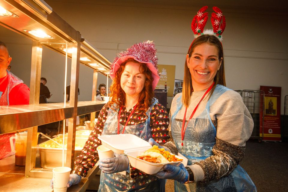 Volunteers Niamh Crowley and Fernanda Power at the 99th Christmas Day Dinner in the RDS. Picture: Mark Condren