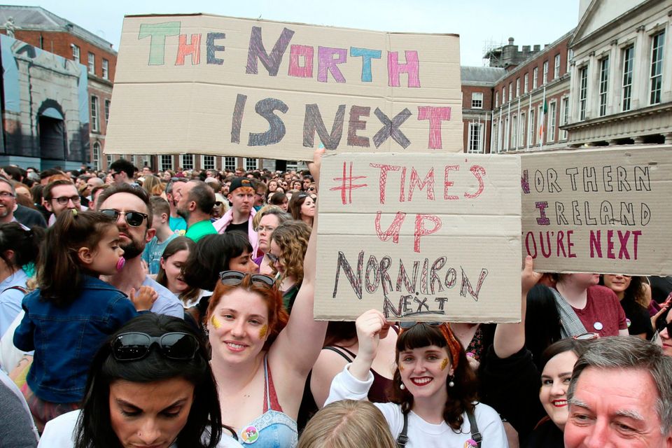 Yes campaigners at Dublin Castle hold signs calling for change in Northern Ireland. Photo: Getty