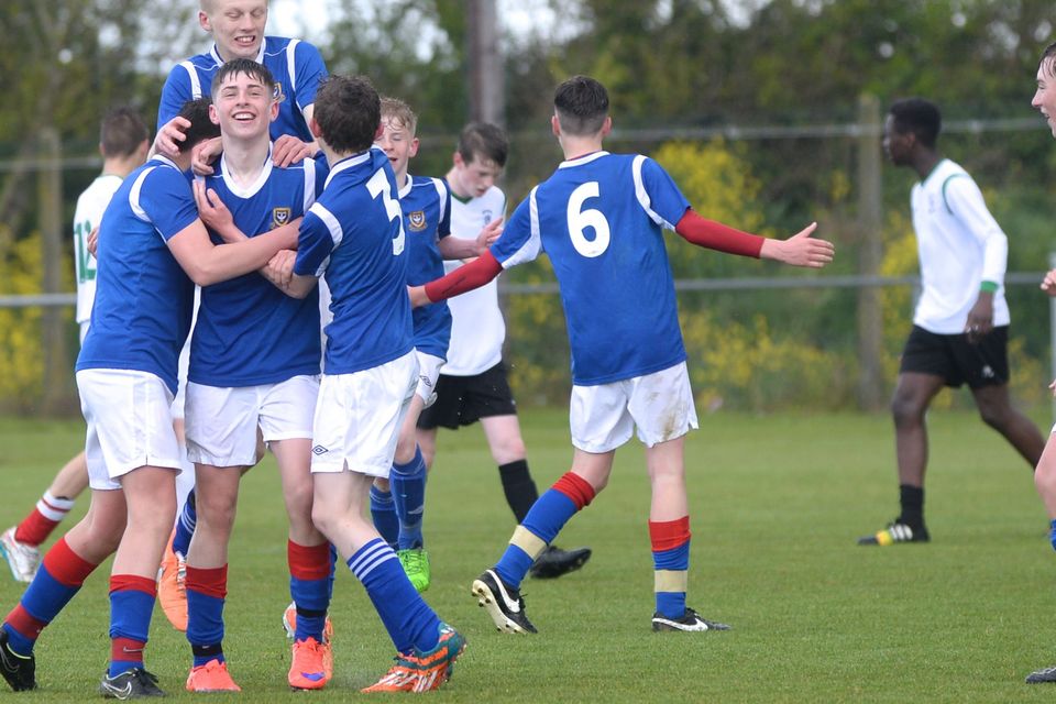 19/05/15. Goalscorer Dylan Reilly is congratulated by teammates during the Under 15s soccer final between Colaiste Phadraig CBS and Templeouge College at Peamount Utd.
Pic: Justin Farrelly.