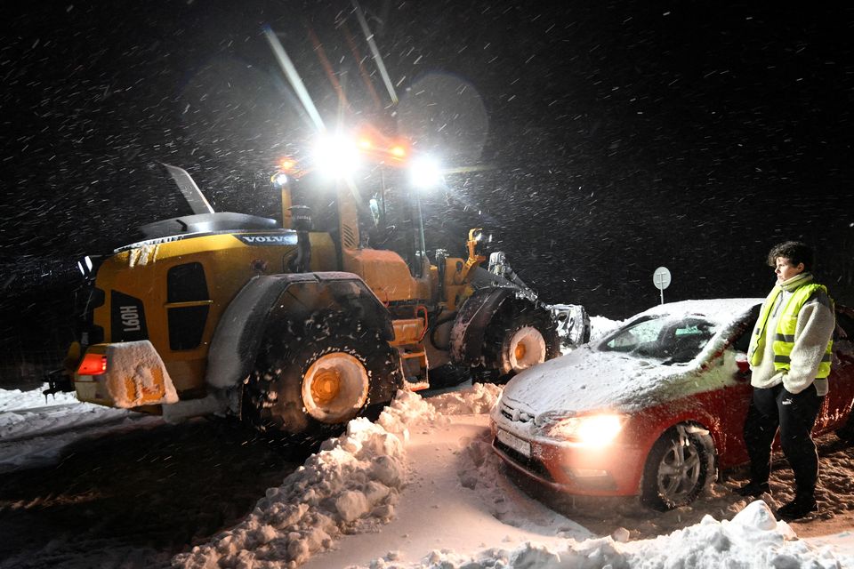 Wheel loaders are clearing snow, cars and trucks are being recovered and people are being evacuated in Home Guard tracked vehicles at Ekerosdlasten on the E22 between Hoby and Kristianstad in southern Sweden.